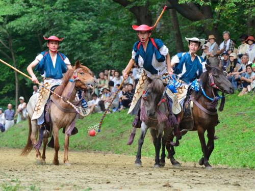 a group of men playing a polo game on horses at Smile Hotel Hachinohe in Hachinohe