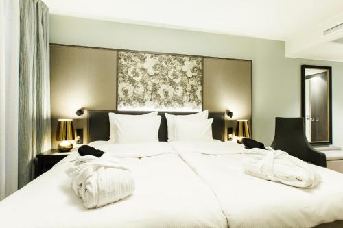 Ένα ή περισσότερα κρεβάτια σε δωμάτιο στο Hotel Sveitsi