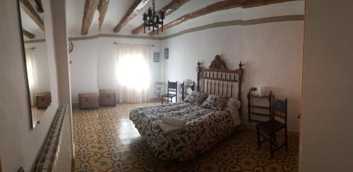 Tempat tidur dalam kamar di Casa Rural Estrella Mudejar