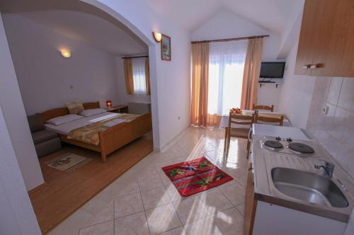 Postel nebo postele na pokoji v ubytování Apartments Lola