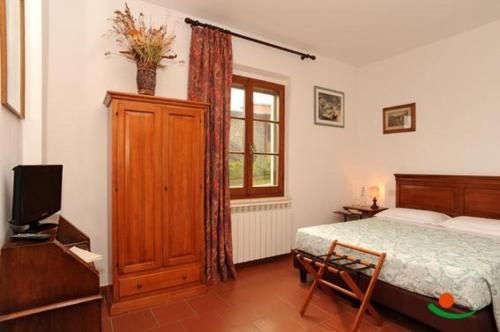A bed or beds in a room at Affittacamere Villa Bagno Santo