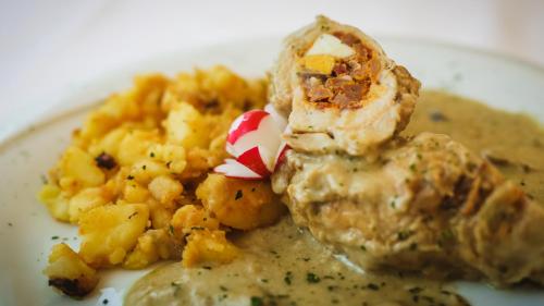 a white plate of food with food on it at Guest House Grgin Dol in Požega