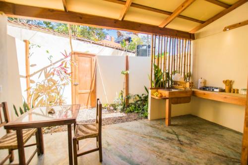 a room with a desk and a table and a window at Galería Suites San Pancho in San Francisco