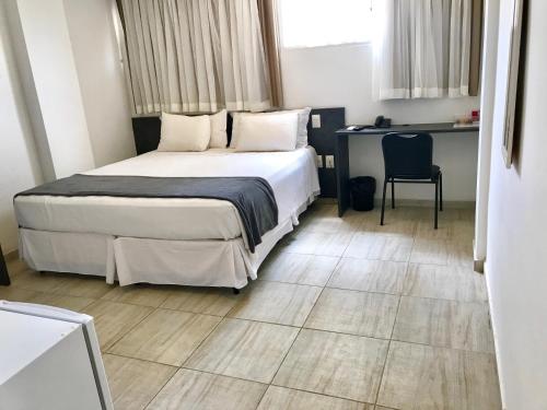 Cama ou camas em um quarto em Scenarium Hotel