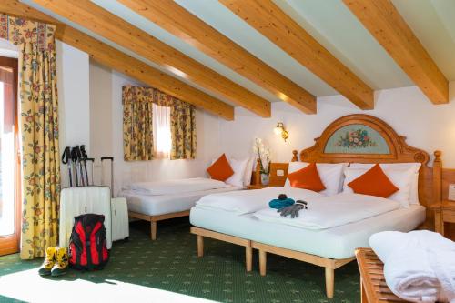 Postel nebo postele na pokoji v ubytování Hotel Bonapace ***S