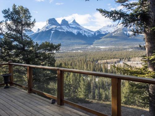 a deck with a view of a mountain at Canmore Alpine Hostel - Alpine Club of Canada in Canmore