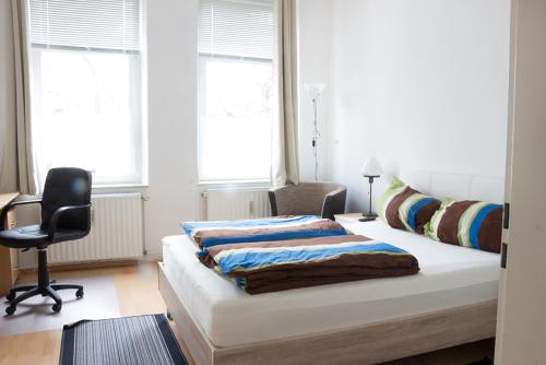 Кровать или кровати в номере Boardinghouse Wilhelmshaven