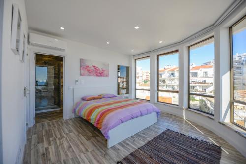 Ліжко або ліжка в номері Luz Beach Rooftop Penthouse