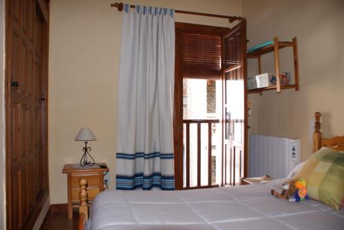 Postel nebo postele na pokoji v ubytování Casa De La Ermita