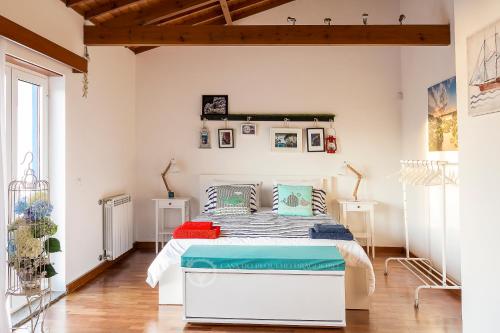 Кровать или кровати в номере Casa do Pequeno Dragoeiro