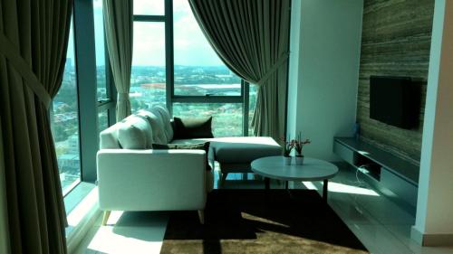 a living room with a couch and a table at Evo Bangi Duplex Homestay D' Imahzzz - 3BR or 2BR in Bangi