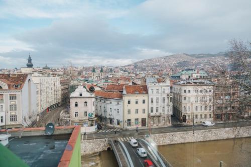 a view of a city with a bridge and buildings at Amazing Penthouse old town in Sarajevo