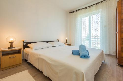 Posteľ alebo postele v izbe v ubytovaní Mimmi apartment