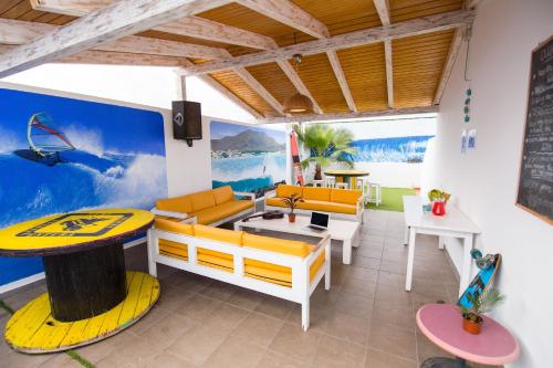 a room with a surfboard painted on the wall at Surf Riders Fuerteventura in Corralejo
