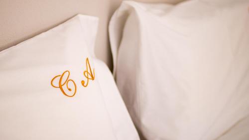 a close up of a wedding dress with the number six at Casa das Andorinhas in Ponte de Lima