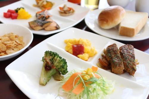a group of plates of food on a table at APA Hotel Gifu Hashima Ekimae in Hashima