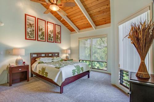 a bedroom with a bed and a ceiling fan at Castle Kanaloa at Kona in Kailua-Kona
