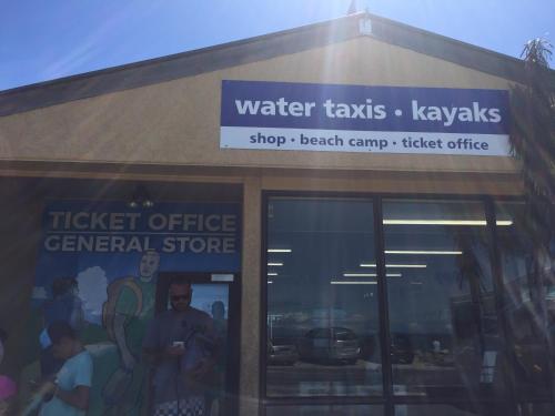 a water taxis kays sign on the front of a store at Abel Tasman Marahau in Marahau