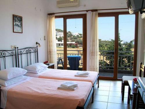 Postel nebo postele na pokoji v ubytování Artemon Hotel