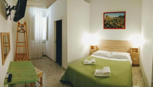 Postel nebo postele na pokoji v ubytování Casa della Nonna Polignano a mare