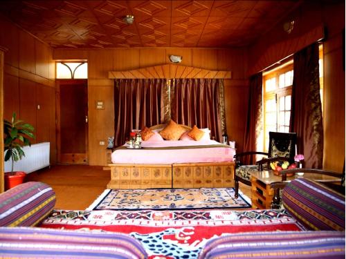 a bedroom with a large bed in a room at Hotel Royal Palace - Leh in Leh