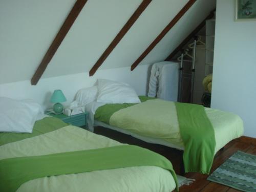 Ένα ή περισσότερα κρεβάτια σε δωμάτιο στο Ty Gwennili