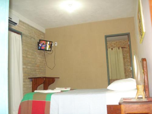 Una cama o camas en una habitación de Pousada 7 Mares