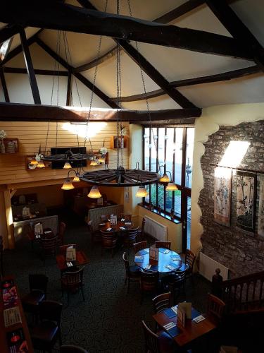 an overhead view of a restaurant with tables and chairs at The Old Barn Inn in Newport