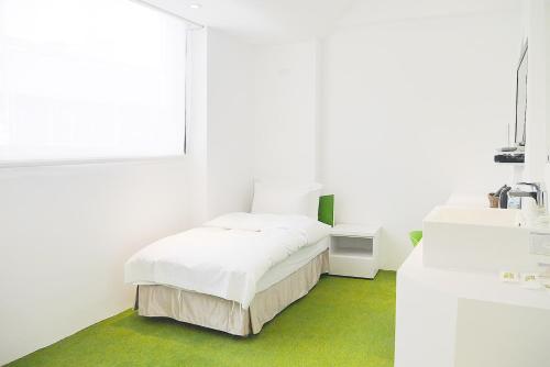 Katil atau katil-katil dalam bilik di Time Flyer Hotel
