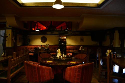 a restaurant with a table and chairs in a room at Diplomat Plaza Hotel & Resort in Lukovit