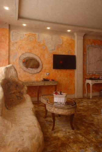 a living room with a couch and a table at Diplomat Plaza Hotel & Resort in Lukovit