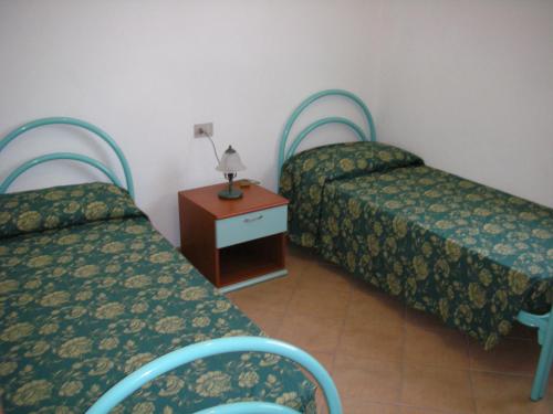Letto o letti in una camera di Case Vacanza Fenicotteri