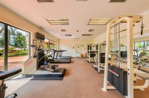 a gym with treadmills and elliptical machines at Phan Thiet Ocean Dunes Resort in Phan Thiet