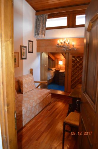a living room with a couch and a table at I mughi - Cortina in Cortina dʼAmpezzo