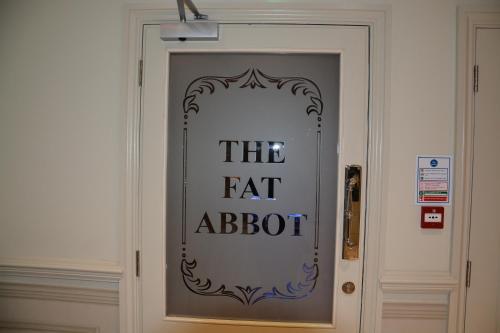a door with the eat abbot sign on it at The Parsonage Hotel & Spa in York