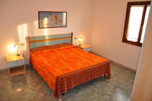 Letto o letti in una camera di Case Vacanza Fenicotteri
