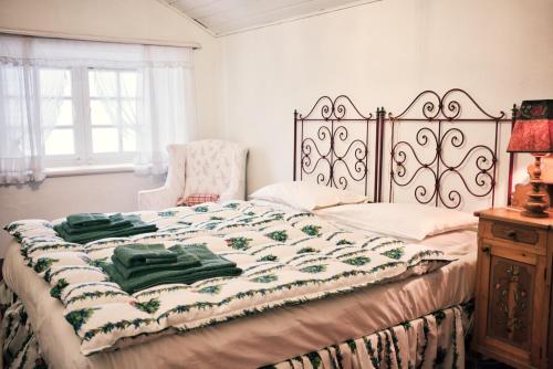 a bedroom with a bed and a chair at La Crestolina in Ala di Stura