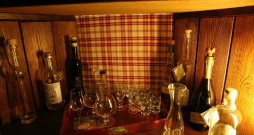 a bunch of wine glasses sitting on a table at Residence Au Vieux Grenier in Cogne
