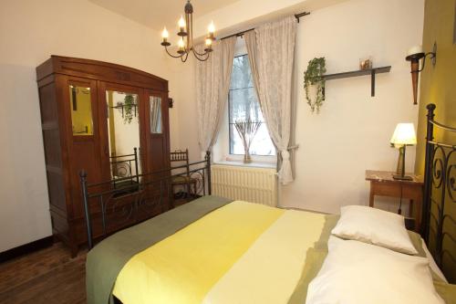 Postel nebo postele na pokoji v ubytování B&B-Restaurant Porte de la Lienne