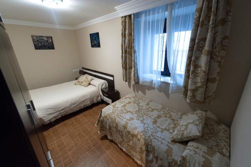 Un pat sau paturi într-o cameră la Apartamento Antequera