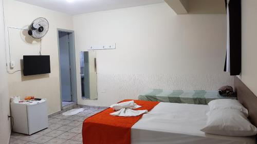 Katil atau katil-katil dalam bilik di Sobradinho Hotel