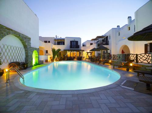 a swimming pool in the middle of a courtyard at Anemomilos in Agia Anna Naxos