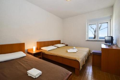Postel nebo postele na pokoji v ubytování Guesthouse Dupin