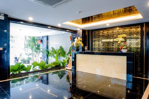 a lobby of a hotel with a swimming pool at Hanami Hotel Danang in Da Nang