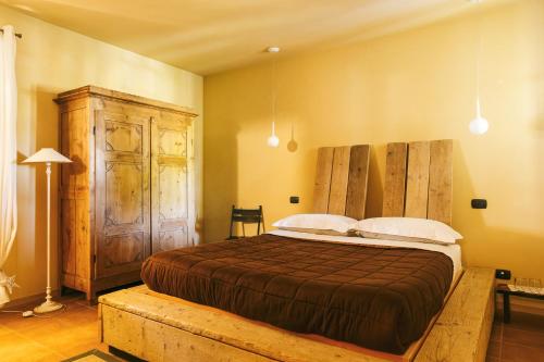 Giường trong phòng chung tại L'Orto Di Panza