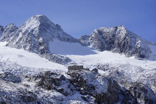 a snow covered mountain with a train on it at Apartment Hanna in Ramsau im Zillertal