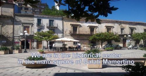 a sign that says we are in the historical center in the main square of cal at Al Palmento in Galati Mamertino