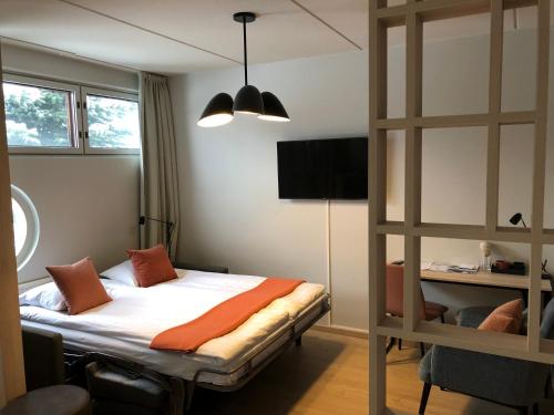 a bedroom with a bed and a bunk bed at Pilot Airport Hotel in Vantaa