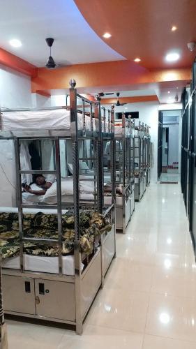 a row of bunk beds in a room at One Step Hostel in Mumbai