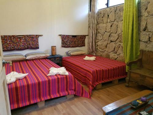 Tempat tidur dalam kamar di Paraíso San José